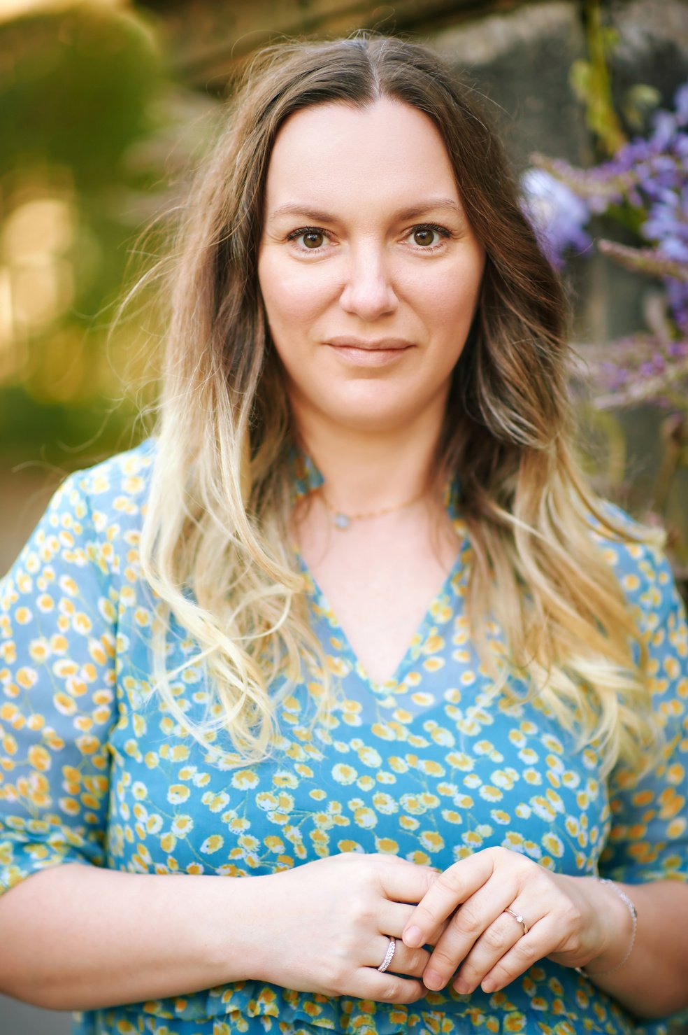 Outdoor spring portrait of pretty 40 year old woman