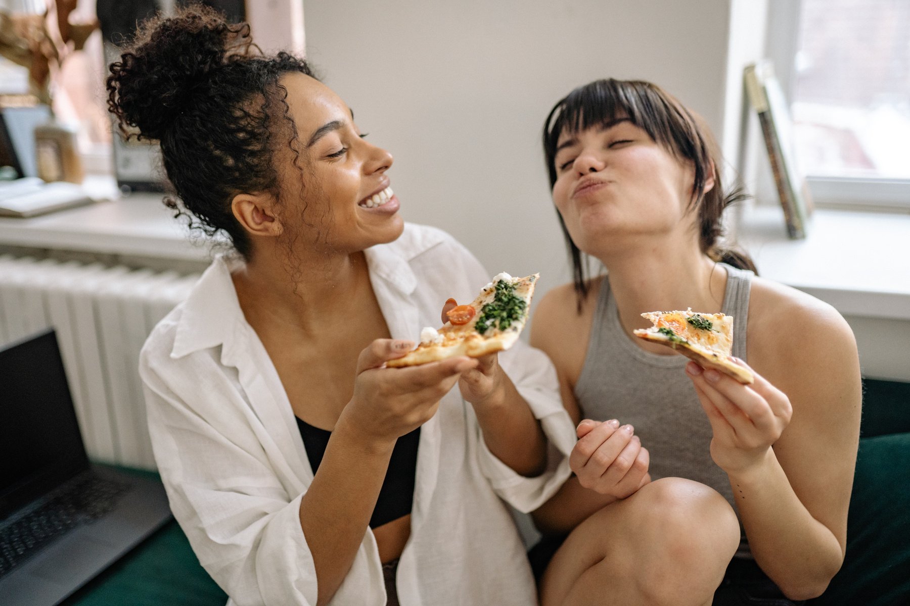 Two Women Eating Pizza